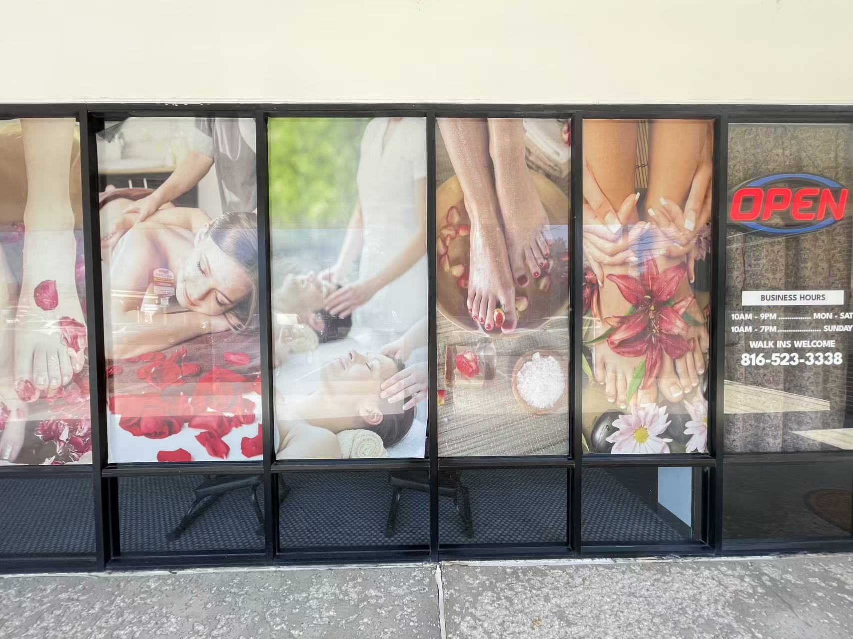 Window display with business hours and phone number