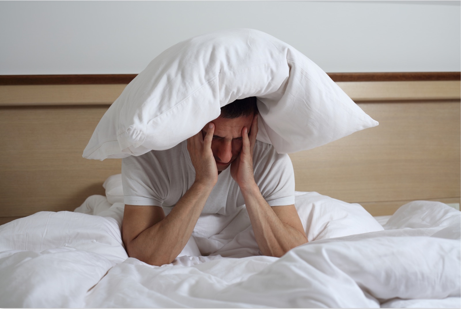 Person awake in bed, unable to sleep