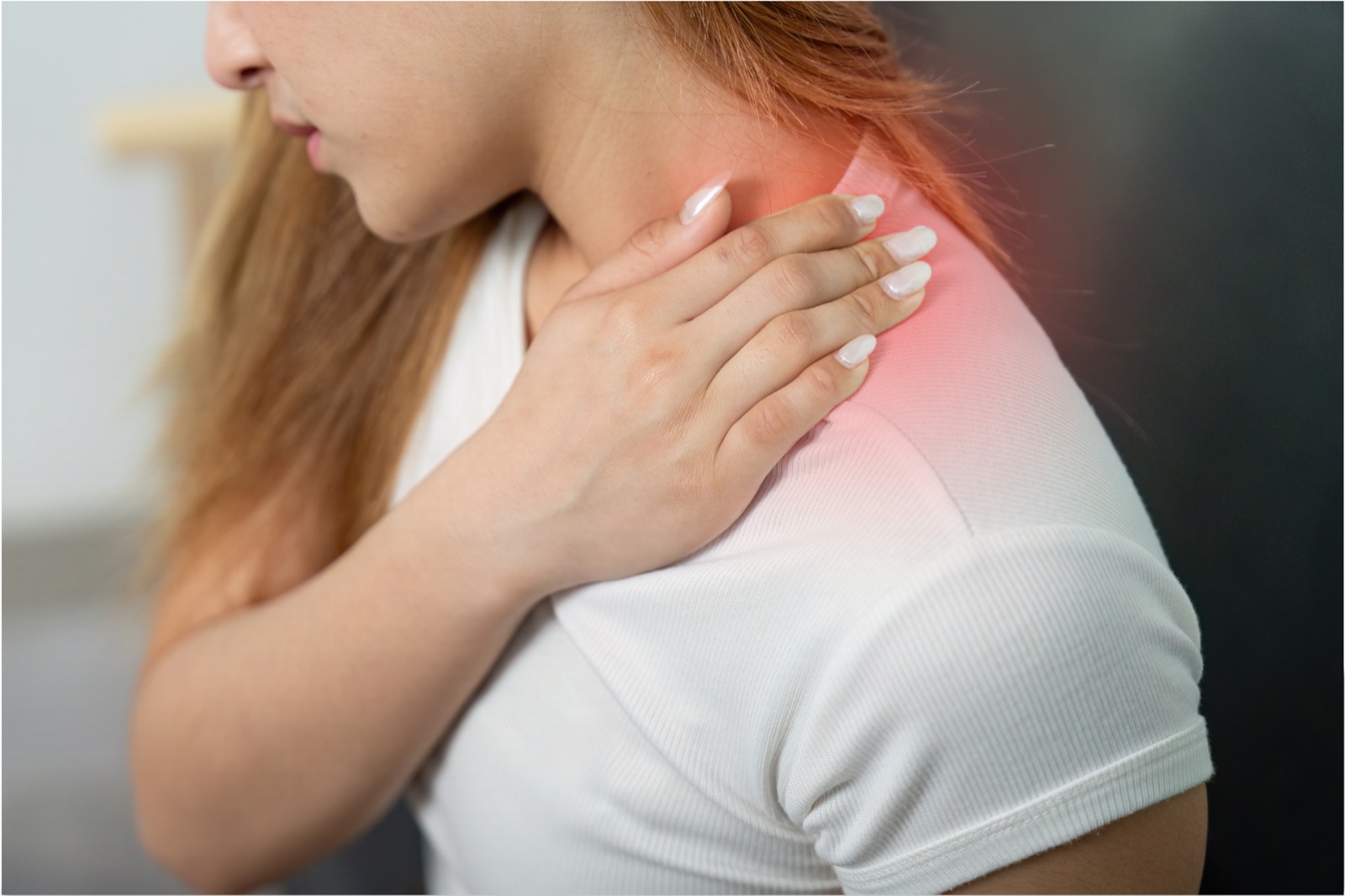Person holding a tense shoulder